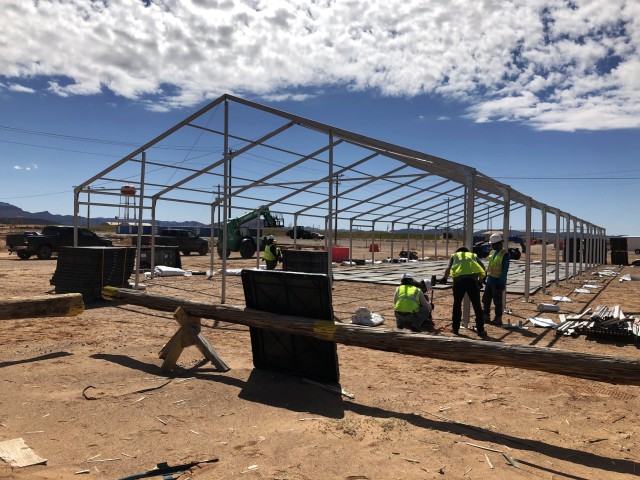 Logistics Civil Augmentation Program contractors erect a structure at Fort Bliss, Texas, March 21. The structure is a part of a life support area for Soldiers returning from deployment who have to enter a 14-day quarantine to prevent the spread of COVID-19. (Courtesy photo)