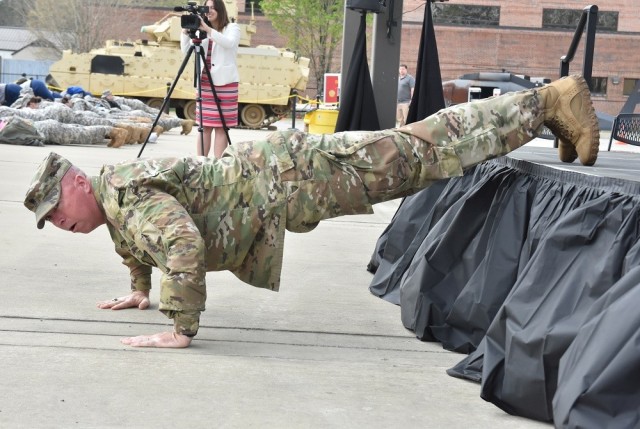 Command Sgt. Maj. Billy Counts leads his customary push-up drill during the 2019 JROTC Day held on Redstone Arsenal.