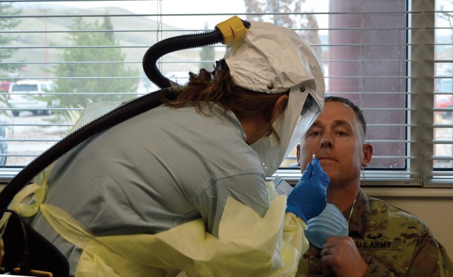 FORT CARSON, Colo. — 2nd Lt. Adam Heard volunteers for a demonstration test for COVID-19 at the newly established Consolidated Screening and Testing Center at Evans Army Community Hospital March 18, 2020. (Photo by Scott Prater)