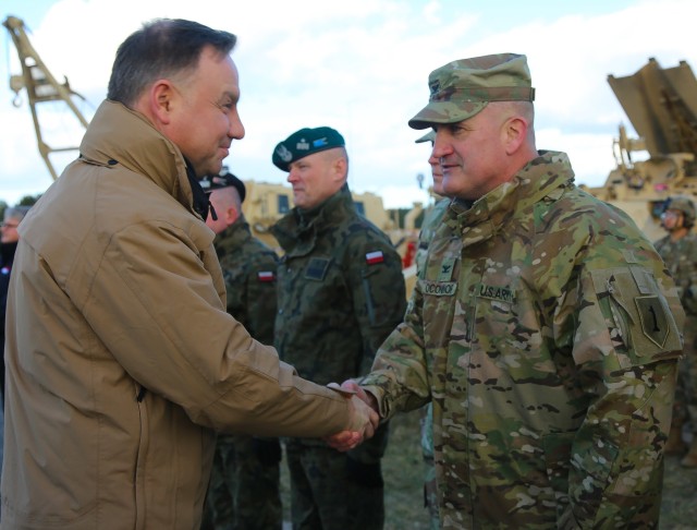 Col. Timothy O'Connor (right), 1st Infantry Division Forward commander, meets with Andrzej Duda, the President of Poland, on March 11, 2020. U.S. and Polish officials visited the base as a part of DEFENDER-Europe 20.