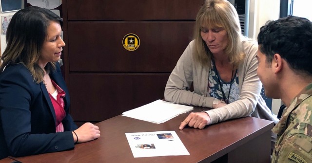 Misty Barr, left, sits down with vocational rehabilitation counselor, Desiree Dial, and 1st Lt. Angel Reyes to discuss potential career opportunities. (U.S. Army photo by Misty Barr)