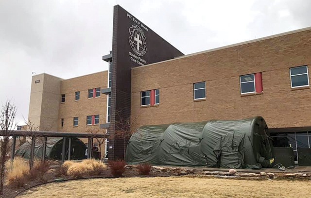 FORT CARSON, Colo. — Patients visiting the Centralized Screening and Testing Center at the Soldier Family Care Center will notice two large tents set up near the entrance. The tent on the right is the education tent for people with COVID-19...