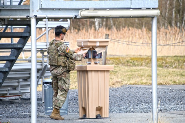 A U.S. Soldier assigned to 2nd Armored Brigade Combat Team, 1st Cavalry Division uses a hand washing station to reduce the potential spread of COVID-19 during training at the 7th Army Training Command’s Grafenwoehr Training Area, Germany, March 19, 2020. (U.S. Army photo by Gertrud Zach)