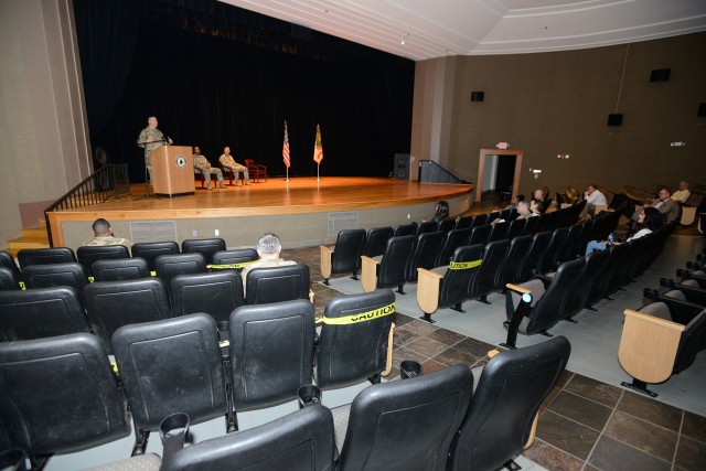 In an almost vacant Waybur Theater, a handful of guests as well as virtual Facebook attendees watch the Garrison Change of Responsibility Ceremony at Waybur Theater March 27.