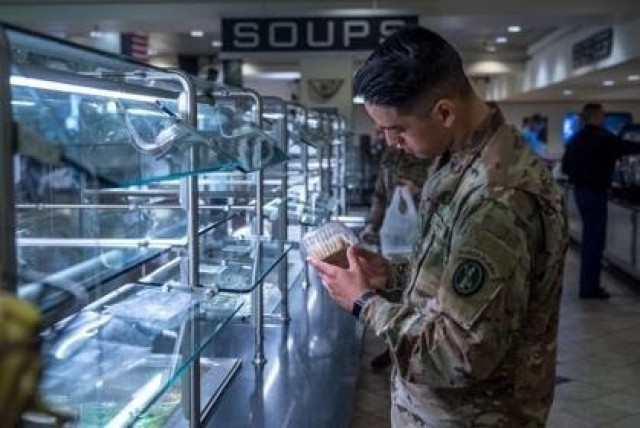 Pvt. Eduardo Ortiz, an infantryman with Honor Guard Company, 4th Battalion, 3d U.S. Infantry Regiment (The Old Guard), selects a prepackaged item at the dining facility, DFAC, on Joint Base Myer - Henderson Hall as part of the shift to a...