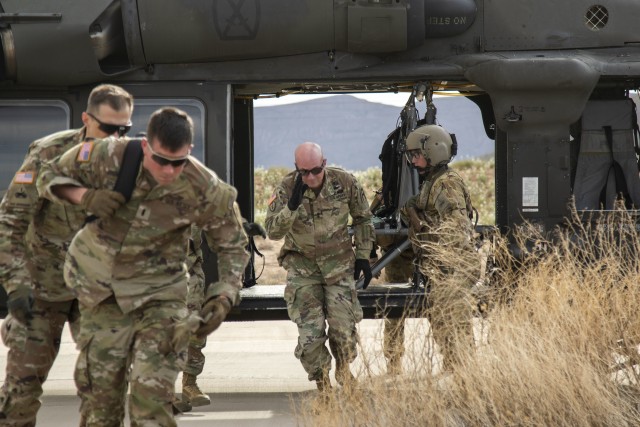 Maj. Gen. Frank Tate, commanding general of First Army Division West, arrives to observe the quality of life for quarantined Soldiers near Fort Bliss, Texas, March 26, 2020.  Soldiers follow Center for Disease Control and Prevention guidelines by going into quarantine for 14 days following travel outside the continental United States.  (U.S. Army photo by Staff Sgt. Timothy Gray, 5th Armored Brigade)