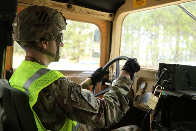 A Soldier assigned to 3rd Infantry Division drives a HMMWV during convoy operations to Savannah, Ga., on Feb. 5, 2020. This movement of equipment is in preparation for the DEFENDER-Europe 20 exercise which takes place in multiple European countries. DEFENDER-Europe 20 demonstrates the strategic readiness of the U.S. military. (U.S. Army photo by Pfc. Joshua Cowden, 22nd Mobile Public Affairs Detachment)