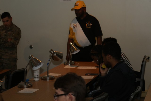 High school students coordinate artillery fire in a Call for Fire simulator during the Georgia High School High Tech tour of Fort Stewart, Feb, 13, 2020. Georgia High School High Tech is a community-based program providing youth with a connection...