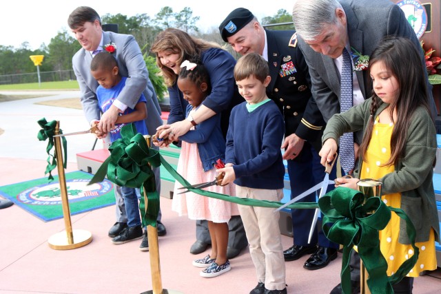 Brian Perry (left), Dr. Judith Minor (center-left), Fort Jackson Garrison Commander Col. John “Wes” Hankins (center-right) and Thomas Brady (right) are accompanied by Wynter Thompson, Gavin Collins, Yzbella Santo and Benjamin Marshall as they...