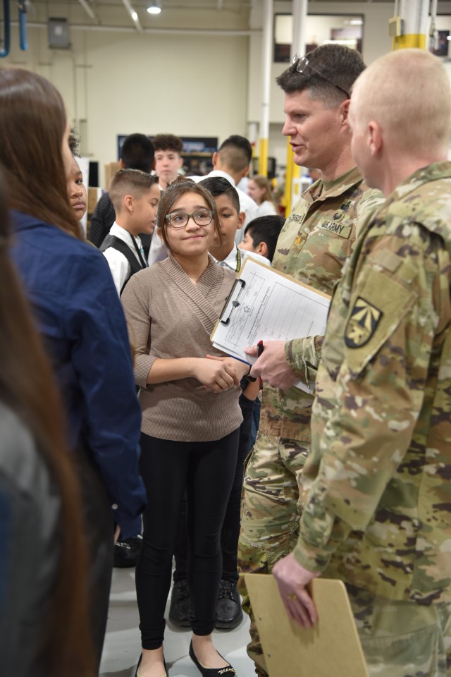 Maj. Richard Telesco and Sgt. Timothy Bright from the U.S. Army Joint Modernization Command talk to students during the Five Star Innovation STEM Cup and Robotics Competition on March 7 at Western Technical College in El Paso, Texas.