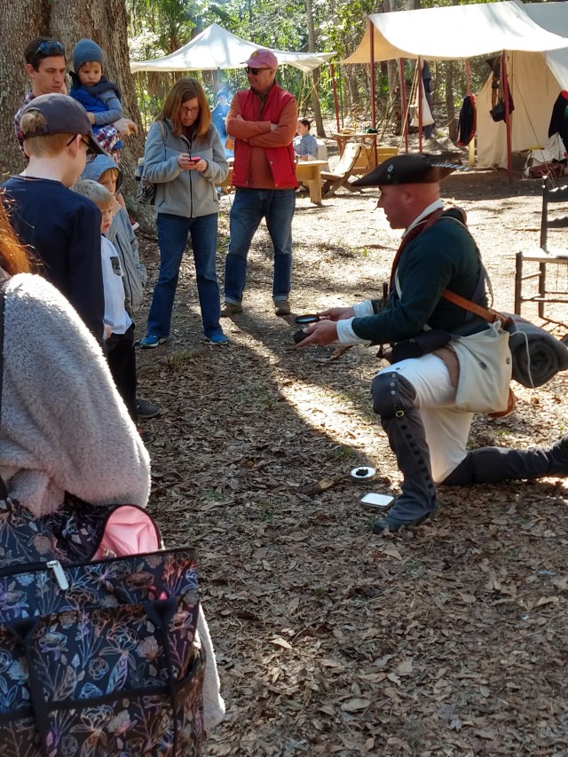 Staff Sgt. Micah Hall, a Soldier with the Fort Stewart’s WTB, who is a volunteer at Wormsloe, portraying an 18th century South Carolina militia, demonstrates how early Soldiers would use flint and steel to make fire.