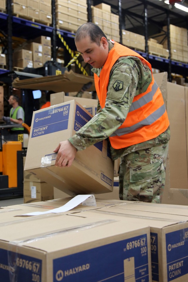 U.S. Army Reserve Sgt. Farid Tehrani, a supply sergeant with Medical Support Unit-Europe, 7th Mission Support Command, loads boxes of medical supplies onto a pallet at the U.S. Army Medical Materiel Center, Europe warehouse in Pirmasens, Germany, March 26, 2020. 7th MSC Soldiers are supporting the shipping and receiving functions in the warehouse to help with the high demand of Army Class VIII medical supplies during the COVID-19 pandemic.