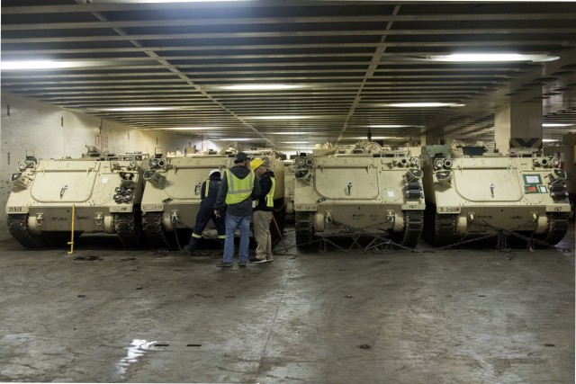 Port of Savannah stevedores secure U.S. Army M113 armored personnel carriers inside American Roll-On Roll-Off Carrier Endurance in preparation for DEFENDER-Europe 20 on Feb. 5, 2020, in Savannah, Ga. Exercise DEFENDER-Europe 20 is the deployment of a division-size combat-credible force from the United States to Europe, the drawing of Army Prepositioned Stock, and the movement of personnel and equipment across the theater to various training areas.  (U.S. Army photo by Pfc. Carlos Cuebas Fantauzzi, 22nd Mobile Public Affairs Detachment)