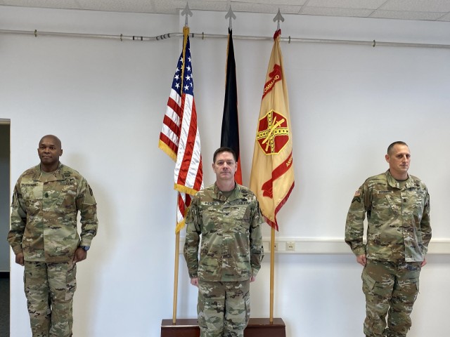 U.S. Army Garrison Ansbach Garrison Commander, Col. Steven M. Pierce, officiates a modified change of responsibility ceremony March 26, where Command Sgt. Maj. Eric S. Bohannon assumed command sergeant major duties from Command Sgt. Maj. Philson...