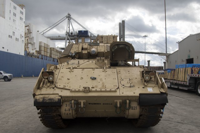 A U.S. Army Soldier stages an M2 Bradley prior to boarding onto American Roll-On Roll-Off Carrier Endurance on Feb. 5 2020 in Savannah, Ga. Exercise DEFENDER-Europe 20 is the deployment of a division-size combat-credible force from the United States to Europe, the drawing of Army Prepositioned Stock, and the movement of personnel and equipment across the theater to various training areas. (U.S. Army photo by Pfc. Carlos Cuebas Fantauzzi, 22nd Mobile Public Affairs Detachment)