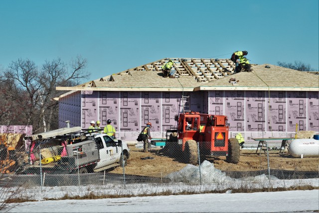 Workers with contractor Relyant Global LLC of Maryville, Tenn., continue work on a U.S. Army Corps of Engineers-led project March 4, 2020, to build seven new military family housing units at the South Post Housing area at Fort McCoy, Wis. A...