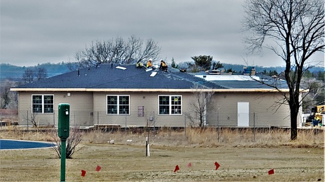 Workers with contractor Relyant Global LLC of Maryville, Tenn., continue work on a U.S. Army Corps of Engineers-led project March 26, 2020, to build seven new military family housing units at the South Post Housing area at Fort McCoy, Wis. A...