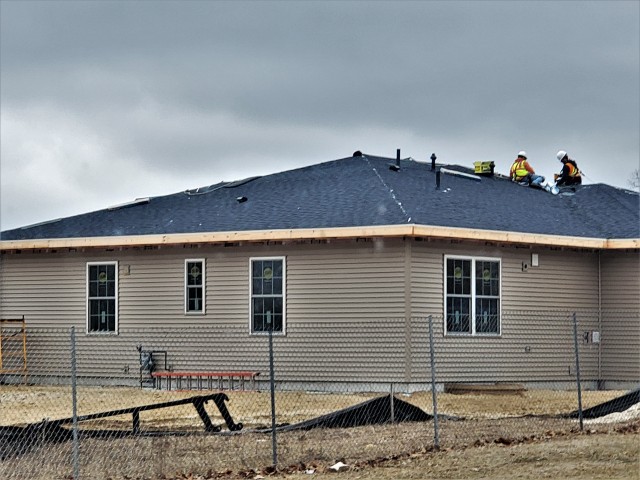 Workers with contractor Relyant Global LLC of Maryville, Tenn., continue work on a U.S. Army Corps of Engineers-led project March 26, 2020, to build seven new military family housing units at the South Post Housing area at Fort McCoy, Wis. A...