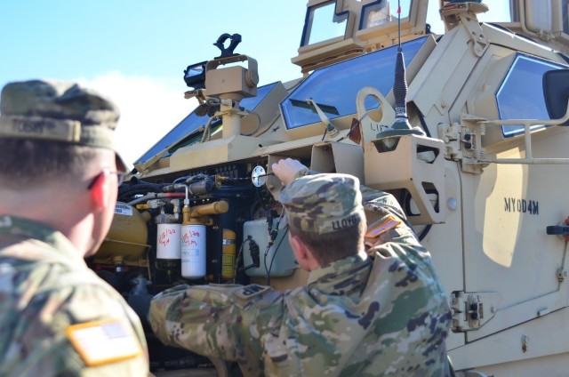 The mechanics assigned to the 385th Military Police Battalion inspect under the hood of the Mine Resistant Ambush Protected All-Terrain Vehicle during training at Fort Stewart, Ga. Feb. 5, 2020. The mechanics trained on maintenance procedures as well as diagnostics and troubleshooting. (U.S. Army photo by Spc. Jason Greaves)