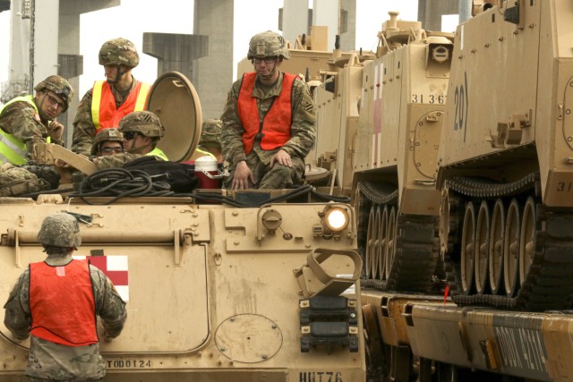 3rd Infantry Division Soldiers conduct maintenance on an M113 armored medical evacuation vehicle (AMEV) to assist in movement and staging of equipment in Savannah, Ga., on Feb. 5. This movement of equipment is in preparation for the DEFENDER-Europe 20 exercise which takes place in multiple European countries. DEFENDER-Europe 20 will conclude with the redeployment of U.S.-based forces and equipment. U.S. service members will clear the training areas, return prepositioned stocks, move to ports and return to home stations – fulfilling the U.S. military’s commitment to the NATO agreements.(U.S. Army photo by Pfc. Daniel Alkana, 22nd Mobile Public Affairs Detachment)