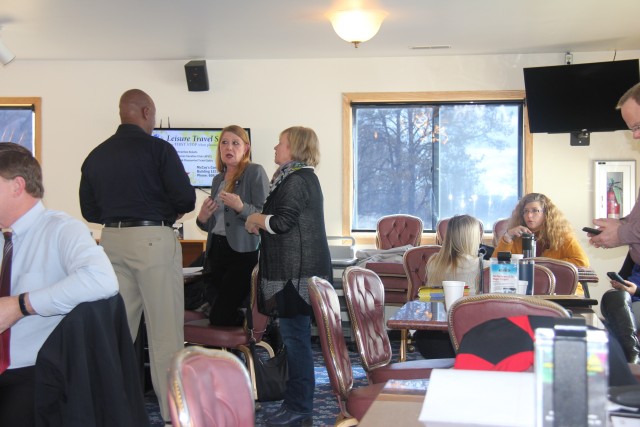 Members of the Wisconsin Inter-Service Family Assistance Committee (ISFAC) speak at the March 5 meeting held at Fort McCoy's Whitetail Ridge Ski Area Chalet. The Wisconsin ISFAC is a military/community cooperative partnership that allows service...