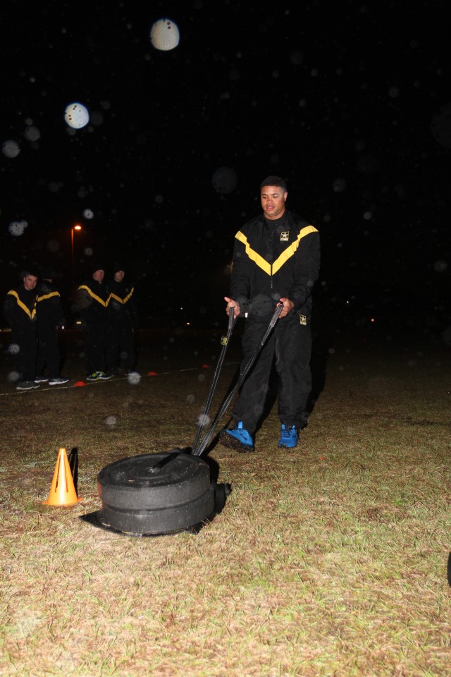 Sgt. Travis Smith, Headquarters Support Company, Headquarters and Headquarters Battalion, 3rd Infantry Division, performs a sprint drag carry in the rain, as part of a familiarization brief for Soldiers of HSC Jan. 31, 2020, on Fort Stewart, Ga....