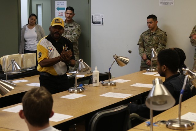 Randy Scales, a training instructor at the Call for Fire Facility, and Soldiers assigned to the 3rd Infantry Division Artillery inform students about opportunities in the Army during the Georgia High School High Tech tour of Fort Stewart, Feb, 13,...