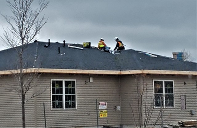 Workers with contractor Relyant Global LLC of Maryville, Tenn., continue work on a U.S. Army Corps of Engineers-led project March 26, 2020, to build seven new military family housing units at the South Post Housing area at Fort McCoy, Wis. A...