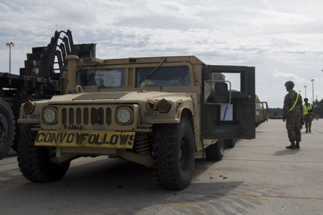 Soldiers assigned to 3rd Infantry Division  prepare to conduct convoy movement in Savannah, Ga., on Feb. 5, 2020. This movement of equipment is in preparation for the DEFENDER-Europe 20 exercise which takes place in multiple European countries. DEFENDER-Europe 20 enhances relationships among NATO Allies and partners. (U.S. Army photo by Pfc. Carlos Cuebas Fantauzzi, 22nd Mobile Public Affairs Detachment)
