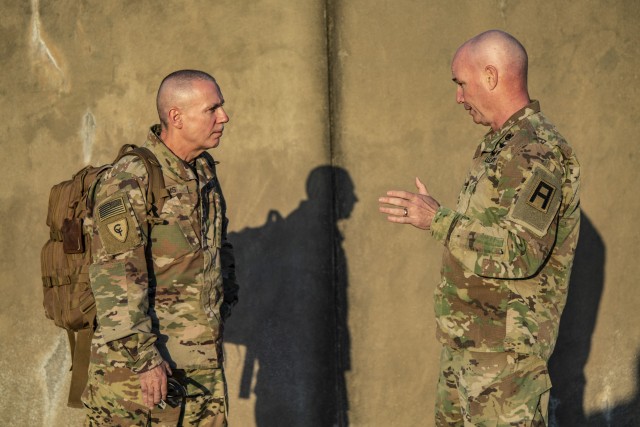 Maj. Gen. Frank Tate, Division West Commanding General, and Maj. Gen. Gordon Ellis, 38th Infantry Division Commanding General, talk about the DEMOB and quarantine process for the Soldiers of the 38th Infantry Division after their completion of a...