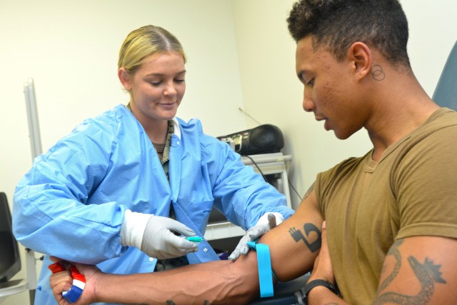 JACKSONVILLE, Fla. (Dec. 9, 2019) – Hospitalman Molly Pratt prepares to draws Naval Aircrewman (Operator) Airman Joshua Smith’s blood at Naval Branch Health Clinic Jacksonville’s Laboratory. Pratt, a native of San Jose, California, says,...