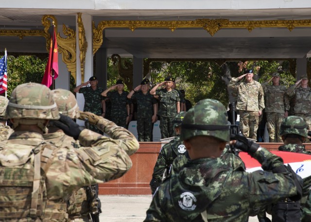 Soldiers from 2nd Battalion, 35th Infantry Regiment, 25th Inf. Division, and their counterparts from the 23rd Infantry Reg., 4th Bat., Royal Thai Army, salute during the American and Thailand national anthems Feb. 24, 2020, at the opening ceremony of Exercise Hanuman Guardian 20 at Camp Friendship in Korat, Thailand. Hanuman Guardian is an annual exercise, now in its tenth iteration, that is designed to enhance U.S. Army and Royal Thai Army capabilities, build strong relationships between both armies and increase mission readiness, enabling regional security and stability in the region.  (U.S. Army Photo by Sgt. 1st Class John Etheridge)