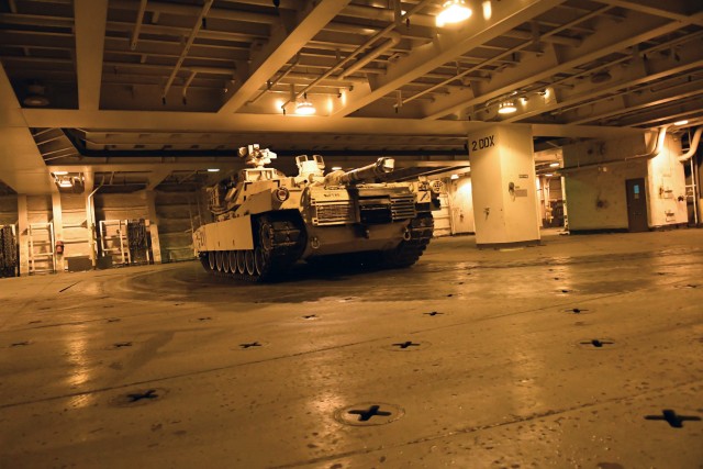 An A1 Abrams tank navigates through the decks of the Bob Hope-class roll-on/roll-off ship USNS Benavidez February 22, 2020 in support of DEFENDER-Europe 20. The ship will carry military equipment to the European theater as part of almost 6,000...