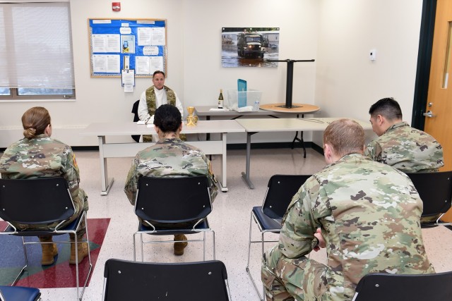 Father Matt Foley, parish pastor for St. James Catholic Church, in Arlington Heights, Illinois, conducts chaplain services for local Soldiers, assigned to the 85th U.S. Army Reserve Support Command, during the unit’s battle assembly weekend...