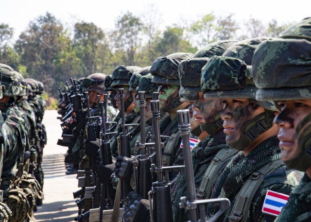 Soldiers from the 23rd Infantry Regiment, 4th Battalion, Royal Thai Army, salute during the American and Thailand national anthems at the opening ceremony of Exercise Hanuman Guardian 20 at Camp Friendship in Korat, Thailand. Hanuman Guardian is an annual exercise, now in its tenth iteration, that is designed to enhance U.S. Army and Royal Thai Army capabilities, build strong relationships between both armies and increase mission readiness, enabling regional security and stability in the region.  (U.S. Army Photo by Sgt. 1st Class John Etheridge)