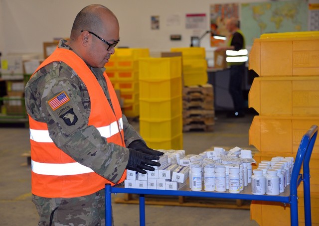 A Soldier from the 7th Mission Support Command works in the warehouse at the U.S. Army Medical Materiel Center-Europe in Germany in support of COVID-19 response efforts.