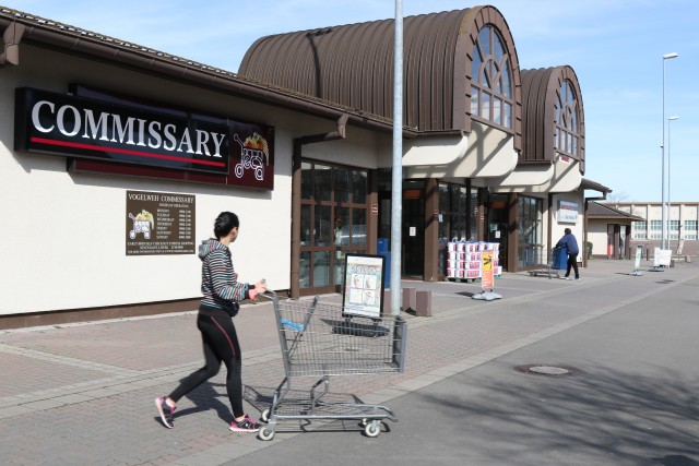 A customer pushes a shopping cart outside of the Vogelweh Commissary in Kaiserslautern, Germany, March 15, 2020. U.S. Army Europe Command Sgt. Maj. Robert Abernethy met with Defense Commissary Agency store directors to discuss restocking...