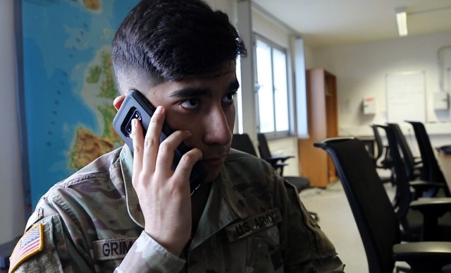 Pfc. Froylan Grimaldo, a public affairs specialist with 7th Mobile Public Affairs Detachment, Headquarters and Headquarters Battalion, III Corps, makes a call on Mar. 19, 2020 in Wiesbaden, Germany. Soldiers can call resources such as Military...