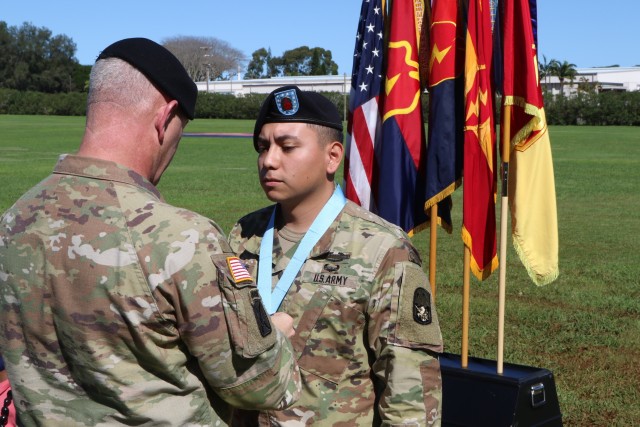 Command Sgt. Maj. Brian A. Hester, 25th Infantry Division Command Sergeant Major (left), presents Staff. Sgt. Paul Navarrete (right) with a Sergeant Audie Murphy Medallion during the Sergeant Audie Murphy Club induction ceremony on February 20, 2019 at Schofield Barracks, Hawaii. The Sergeant Audie Murphy Club is for U.S. Army non-commissioned officers whose leadership and performance may earn them membership in this prestigious club. (U.S. Army Photo By Sgt. Malcolm Cohens-Ashley