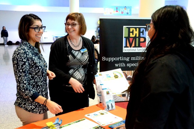 Ariana Oregel, USAG Rheinland-Pfalz Exceptional Family Member Program director (left) and Kelley Hood, USAG Rheinland-Pfalz EFMP program systems navigator, discuss EFMP programs with a military family member at a recent outreach event at the...