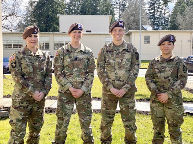 Four Advisors from the 5th Security Force Assistance Brigade Medical Section pose for a photo.  These Advisors assisted Joint Base Lewis-McChord with gym facility  assessments during the COVID-19 response. From left to right, Maj. Amanda Webb, Brigade Psychologist, Capt. Kelly Spencer, Brigade Medical Advising Team Nurse, Maj. Kimberley Maxwell, Brigade Field Surgeon and Cpl. Natalie Pagan, Brigade Physical Therapy Technician.