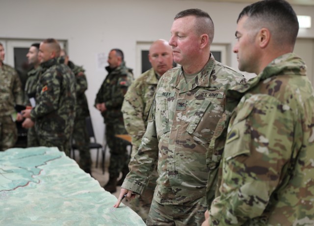 U.S. Army Col. Eric Riley, commander of the 41st Infantry Brigade Combat Team, consults Lt. Col. Kyle Akers, commander of the 2nd Battalion, 162nd Infantry Regiment, 41st Infantry Brigade Combat Team, Oregon Army National Guard, on the upcoming...