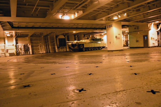 An A1 Abrams tank navigates through the decks of the Bob Hope-class roll-on/roll-off ship USNS Benavidez February 22, 2020 in support of DEFENDER-Europe 20. The ship will carry military equipment to the European theater as part of almost 6,000...