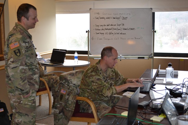 Capt. Matthew Barber and Sgt. 1st Class Jeffrey Hedges review the list of West Point people in quarantine, at Keller Army Community Hospital's Clinical Operations Room. After the 14-day quarantine, the process of clearing begins with a phone call from a representative of either West Point Public Health or Keller's Clinical Operations, and includes a series of questions for the 'quarantined person' and any family members. Once the questions are answer, a determination of continued quarantine or release from quarantine is made. If the person is released from quarantine, they will receive a memorandum of release. (Photo by Rober Lanier/Keller PAO)
