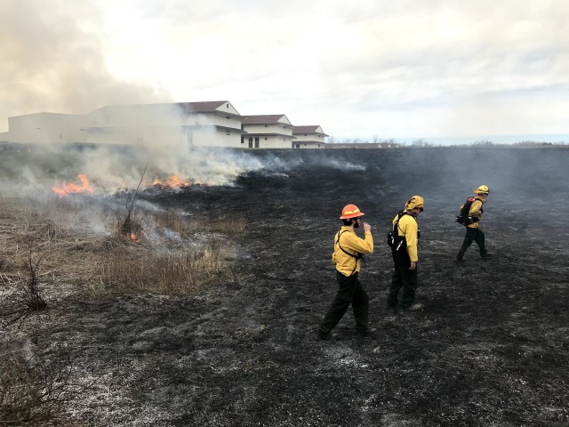 Environmental staff and contractors assigned to Fort Custer Training Center (FCTC), Michigan Army National Guard, conduct prescribed burns, FCTC Augusta, Mich., Oct. 24, 2019. The controlled burn assists in pushing back invasive species and to stimulate growth in native prairie plants. Prescribed fire is one way Fort Custer preserves, protects, and restores environmental quality and promotes eco-friendly stewardship. (Photograph by Michele Richards/released)