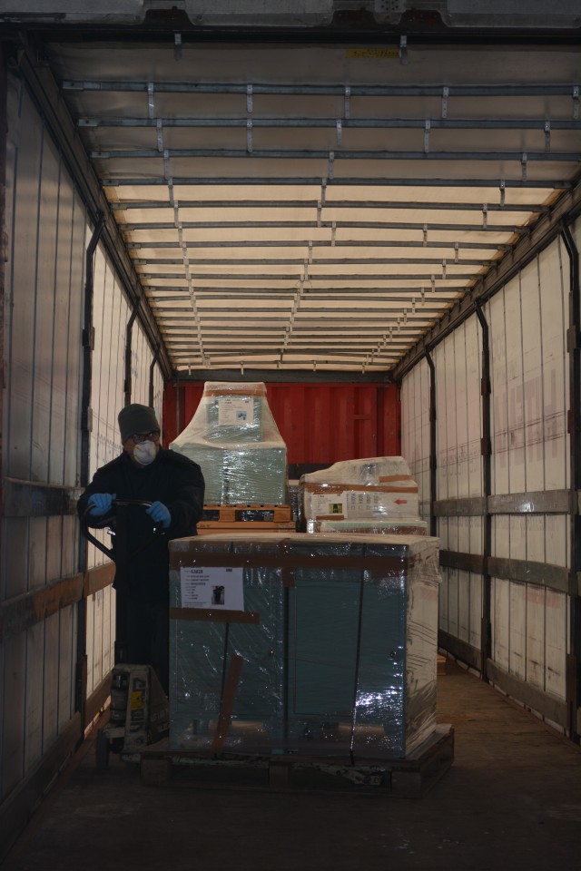 CAMP DARBY, Italy (March 25, 2020) - Fabio Simonini, Humanitarian Assistance Warehouse Worker secures medical equipment in a trailer truck bound for Rho, Lombardy in support of COVID-19 emergency in Rho, Lombardy, Italy, Italy in support of...
