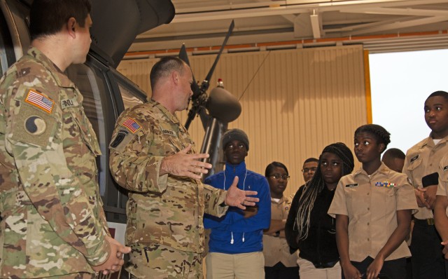 Chatham County, Georgia Junior Reserve Officers’ Training Course cadets receive a walkthrough of the different aircraft U.S. Army Warrant Officers train to fly in during Hunter Army Airfield JROTC Day, March 4, at HAAF in Savannah, Georgia....