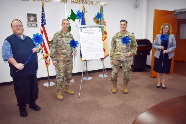 From left, Stan Austin, manager of the U.S. Army Garrison Japan Family Advocacy Program; USAG Japan Command Sgt. Maj. Billy Norman; Col. Thomas Matelski, commander of USAG Japan; and Jen Partridge, director of USAG Japan Army Community Service,...