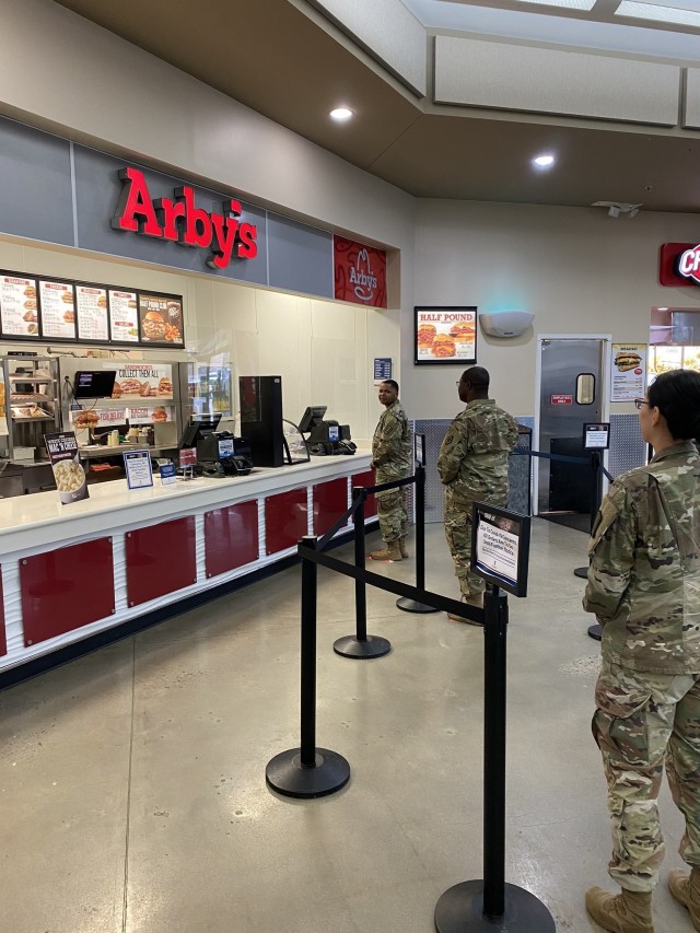 Soldiers practice social distancing while waiting to order at a restaurant at Fort Jackson's food court. The installation has been enforcing social distancing in all activities including making all food establishments carry-out only and patrons...