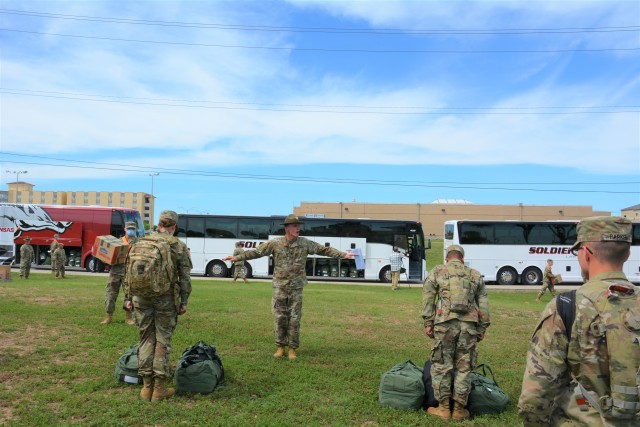 A Drill Sergeant assigned to the 232nd Medical Battalion demonstrates the proper social distancing to 68W Combat Medics arriving from Fort Sill, OK to begin their advanced individual training at Fort Sam Houston, TX.